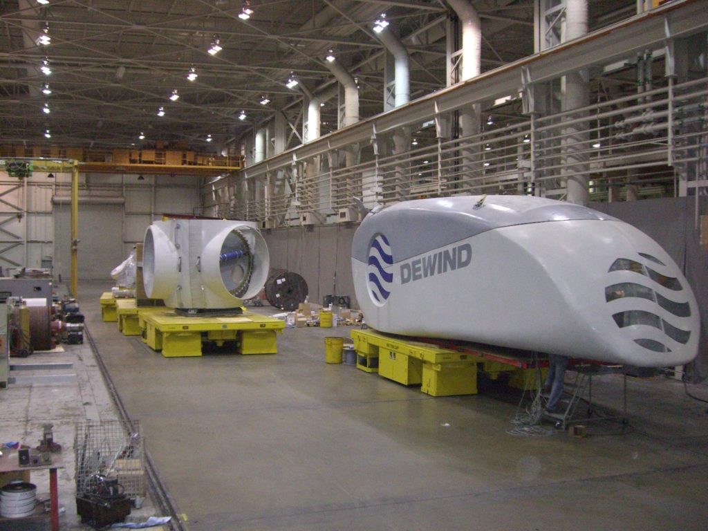 These 100-Ton All Wheel Steer Transporters were designed to be loaded and unloaded with an overhead crane. They are used during the manufacturing of wind turbines. They are 10’ wide x 16’ long.